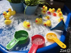 a bath tub filled with lots of water and rubber ducky toy ducks in it