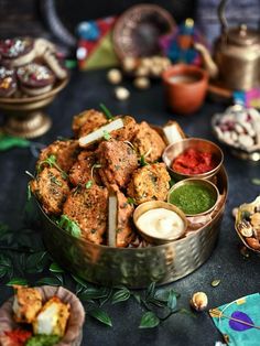 there are many food items in the bowl on the table and one is ready to be eaten