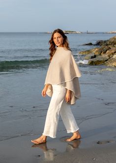 Made from a substantial merino wool and cashmere blend, our knit cape is the ultimate transition (and travel) piece. Wear it wrapped as a cape or draped open like a shawl, it strikes the perfect balance between upscale elegance and cozy functionality. Shawl Outfit, Cape Outfit, Sweater Cape, Cape Sweater, Knitted Cape, Wool Cape, Alpaca Sweater, Cashmere Yarn, Cashmere Shawl