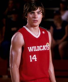 a male basketball player in a red uniform