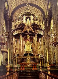 an ornate alter in a church with candles