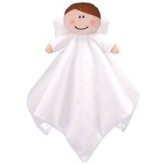 a white angel stuffed animal with brown hair and eyes on it's back, wearing a white blanket