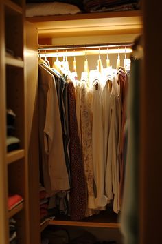 the closet is full of clothes and ties