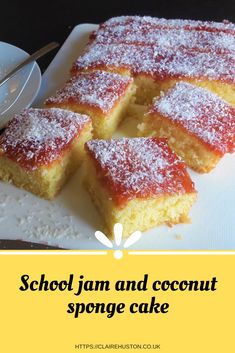 there is a cake with powdered sugar on it and the words school jam and coconut sponge cake