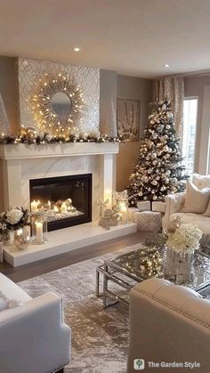 a living room decorated for christmas with candles and decorations on the fireplace mantels