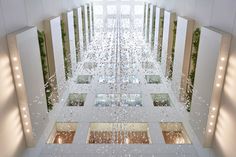 an aerial view of the inside of a building with rain falling down on the floor