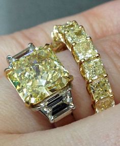 A yellow diamond and diamond engagement ring with a yellow diamond eternity band. Both by Sasha Primak. Via Diamonds in the Library. Diamond Eternity Band, Eternity Ring Diamond, Eternity Band Diamond, Diamond Eternity