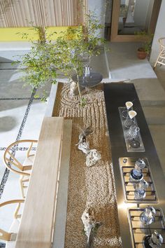 an aerial view of a dining room table with plates and utensils on it