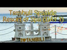 a sign that says tambul seaside resort & spa day 1