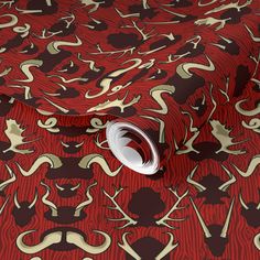 a red and gold wallpaper with an abstract pattern on it's surface,