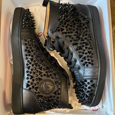 Elevate Your Shoe Game With These Black Louis Mid-Top Spiked Leather Laboutin Sneakers From Christian Louboutin. Designed For Men, These Casual Shoes Feature A Sleek And Stylish Design That Is Perfect For Any Occasion. The Upper And Outsole Are Made Of High-Quality Leather, Ensuring Durability And Comfort. With A Us Shoe Size Of 12, These Sneakers Are Perfect For Any Man Looking To Add A Touch Of Sophistication To Their Wardrobe. The Black Color And Spiked Design Add A Touch Of Elegance And Edginess To Any Outfit. Don't Miss Out On The Chance To Own These Amazing Sneakers. Black Leather Sneakers With Studs, Luxury Black Sneakers With Spikes, Designer Leather Sneakers With Spikes, Black Leather Sneakers With Spikes, Mid Top, Men Looks, Shoe Game, Christian Louboutin Shoes, High Quality Leather