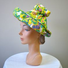 "Vintage 1960s chartreuse/acid yellow straw hat, with printed cotton brim and crown.  The crown is gathered at the top and is open on the top.  It has an upturned brim.  The hat is in good condition -- no holes; it has a few very faint, small spots.  The interior circumference is 21\", the brim is 3.25 - 4.5\" wide and the crown is 7\" tall. ---> If you need an order shipped by a particular date or shipped via a quicker method, please ask PRIOR to purchase to see if we can accommodate that reque Vintage Green Adjustable Hat, Retro Wide Brim Sun Hat For Summer, Retro Wide Brim Summer Hat, Vintage Cotton Sun Hat With Curved Brim, Retro Summer Hat With Curved Brim, Retro Summer Sun Hat, Green Vintage Adjustable Sun Hat, Vintage Yellow Brimmed Sun Hat, Vintage Cotton Wide Brim Sun Hat