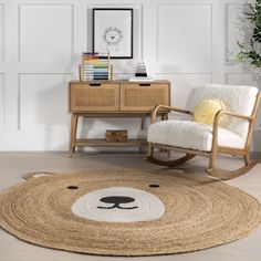 a bear rug on the floor next to a chair and table with a potted plant