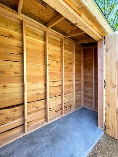 the inside of an empty wooden storage shed