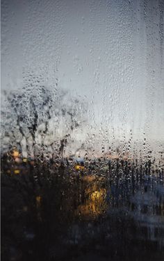 rain drops on the window and buildings outside