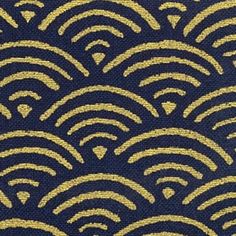 a blue and gold fabric with an abstract design