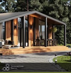 a house with wooden sidings and glass doors on the front porch is surrounded by greenery