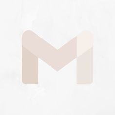 an image of a white and beige background with the letter m in it's center