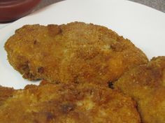 three pieces of fried food on a white plate