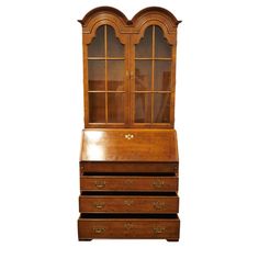 an old wooden desk with two drawers and a glass door on the top, against a white background