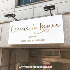 a sign that reads creme d'rence on the side of a building