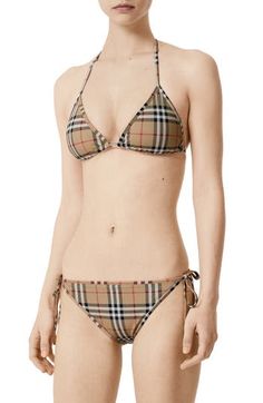 Show love for Burberry while at the beach with this two-piece triangle bikini patterned in an archival check that dates back to the '60s. Ties behind neck and back; side ties Removable cups Lined 74% polyamide, 26% elastane Hand wash, dry flat Made in Portugal Collectors 2000s Swimwear, Burberry Swimsuit, Burberry Beauty, Satin Bralette, 60s Style, Two Piece Swimsuit, Beach Swimsuit, Burberry London, Luxury Items