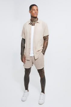 Bring the summer party vibes with colourful shirt and short sets. Did someone say garden party? Make an entrance and turn heads with a bold printed shirt and shorts set matched with a bucket hat and statement sunnies, perfect for your mates back patio or the beachside bar on your summer getaway. Prefer to blend in? How about a soft grey or beige with a white tee and loafers, or khaki over a black tee and a dog tag pendant. Whatever your vibe, we've got you covered from the beach to the bars – and when summer's over, swap the shorts for jeans or cargo pants or layer up with a contrasting bomber jacket – presto!Style: Shirt & Shorts SetDesign: Fabric InterestFabric: CheeseclothDetail: TexturedNeckline: CollaredSleeve Length: Short Sleeve Mens Vacation Outfits, Summer Fits Men, Vacation Outfits Men, Boohoo Man, Mens Summer Outfits, Cool Outfits For Men, Summer Outfits Men, Cheese Cloth, Mens Fashion Summer