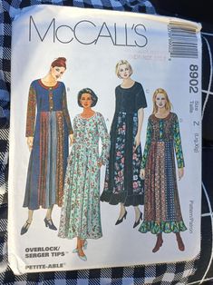 three women's dresses and one woman's dress are shown in this sewing pattern