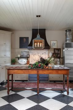 the kitchen is clean and ready to be used for cooking or baking, with an island in the middle