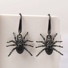 This is a spider earrings with black spinel, Sterling Silver Stud Earrings, Halloween Earrings, Animal Jewelry Cute and affordable earrings quirky and fun. The perfect gift for you or a friend or family member This unique spider earrings will bring a perfect touch of flair to your outfit. All HANDMADE ITEMS SHIP IN APPROX 8 DAYS Main Stone: Natural black spinel Main Stone Size: Round cut 1.3 x 1.3 mm (6) and 1.5x 1.5 mm(14) Main Stone Weight: 1.064 carat Side Stone: None Material: 925 Sterling S Black Spooky Jewelry For Party, Spooky Black Jewelry For Party, Black Spooky Party Jewelry, Black Novelty Jewelry For Party, Novelty Black Jewelry For Party, Spooky Black Earrings For Party, Spooky Black Jewelry For Halloween, Black Halloween Party Earrings, Black Novelty Drop Earrings