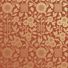 an orange and gold wallpaper with flowers on it