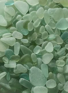 green and white sea glass is in the water