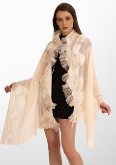 Indulge in the ultimate opulence with this ivory scarf woven from the finest cashmere. Wrap yourself in this statement piece elevated by its handcrafted tonal pearl-embroidered daisy flowers, exotic ivory lace panels and an ivory frill detailing on one side. This scarf brings with it a sense of timeless beauty, perfectly blending luxurious warmth and refined elegance. It is the ideal accessory to make heads turn on any formal evening out or a special occasion. Embroidered Silk Scarves For Wedding, Silk Shawl With Floral Embroidery For Wedding, Elegant White Shawl With Floral Embroidery, Luxury Pashmina Shawl For Formal Occasions, White Silk Scarf Shawl, Cream Silk Scarf For Formal Occasions, Elegant Formal Embroidered Pashmina Shawl, Elegant Cream Silk Scarf, Elegant Embroidered Wedding Shawl