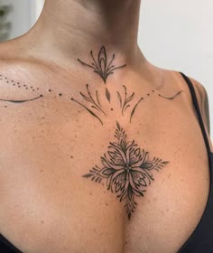 a woman with a tattoo on her chest