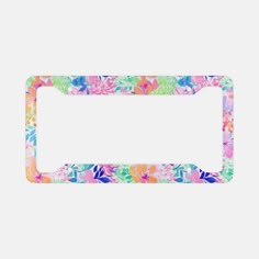 a license plate frame with flowers and leaves on the front, in multi - colored colors