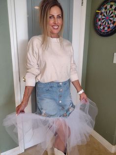 These are all the rage - this Denim Mini Skirt with Tulle is ready to make a statement! With a lightweight, faded denim and a chic tiered tulle layer detail you can dance and twirl the night away without a single worry! It's the perfect way to give your look an extra pop of style and sass! Add boots and there you go! This is a Size L, but I believe after washing it's more like a medium, with a waist measuring 30 inches and length of the mini skirt is 25 inches from the waist.