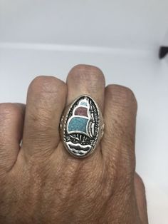 Heavy Silver finished white bronze  Does not change color 1980's unused piece Genuine gemstone Inlay ship very detailed All jewelry is shipped in a nice gift box.   We now can custom size to 14-16 etc. Jeweler's fee is $20 to be paid separately.  Takes a week to modify. Mens Turquoise Rings, Stone Inlay, Vintage Rock, Men's Jewelry Rings, Turquoise Rings, Genuine Turquoise, Men's Ring, Coral Turquoise, 1980s Vintage