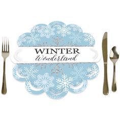 a table setting with silverware, forks and napkins on it that says winter wonderland