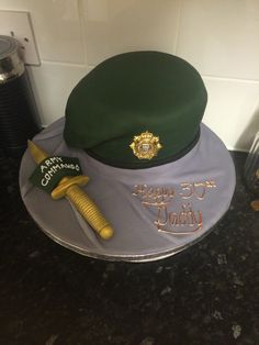 a green and purple hat on top of a counter