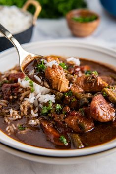 a white plate topped with meat and rice