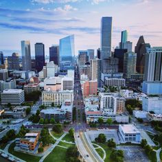 an aerial view of a city with tall buildings