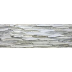 a white and grey tile wall with wavy lines on it's sides, in the shape of waves