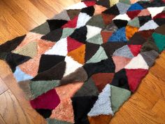 a multicolored area rug on the floor