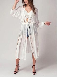 Add a touch of boho chic to your wardrobe with this kimono style cardigan. The front lace detail adds a touch of femininity and the long, flowy fit is perfect for a day at the beach or pool. This versatile piece can be worn as a cover up for your swimsuit, or as a festive addition to your outfit for a spring or summer party. Take it on your next resort vacation for a touch of bohemian flair. This kimono cardigan is the ultimate beach boho accessory Small (2/4), Medium (6/8), Large (10) Maxi Card Chic Lace Cover-up For Beach Season, Spring Beach Party Cover-up With Crochet Trim, Bohemian Lace Patchwork Summer Cover-up, Chic V-neck Festival Cover-up, Bohemian Spring Brunch Cover-up, Chic Lace Trim Beach Cover-up, Flowy V-neck Cardigan For The Beach, Spring Festival Lace Cover-up, Lace Open Front Cover-up For Summer