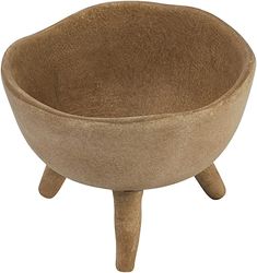 a small wooden bowl with legs on the bottom and one leg raised up to it's side