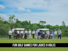 a group of people standing on top of a lush green field next to a golf cart