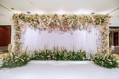 an elegant wedding setup with flowers and greenery