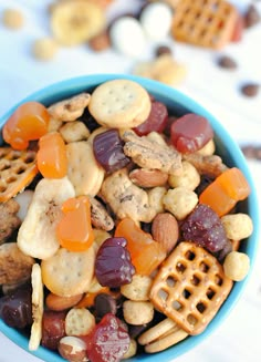 a blue bowl filled with snack mix