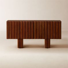 the sideboard is made out of wood and has two legs that are bent to one side