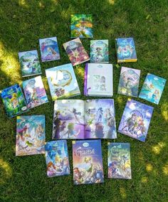 the book collection is laid out on the grass and ready to be used as an art project